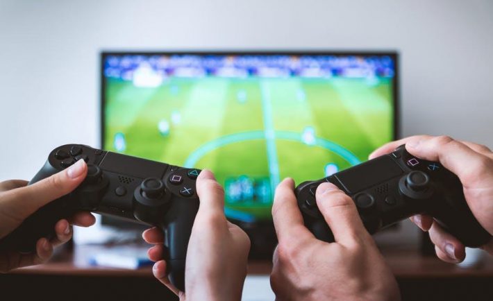What does playing video games and playing a favorite sport have in common 1