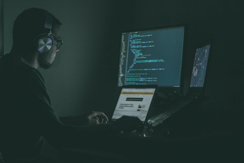 A person sitting in front of a computer screen
Description automatically generated with low confidence